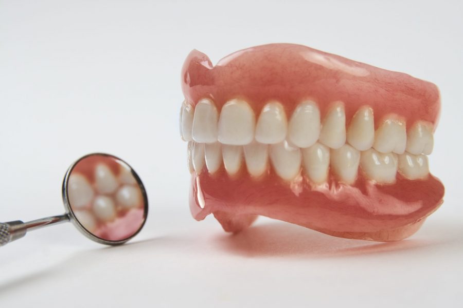 What Is The Cost Difference Between Implants and Dentures?